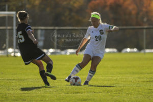 Kelsey Espnenorst (20) clears the ball from the Quakers Jillian Calhoun. Photo by Amanda "The Homeowner" Ruch