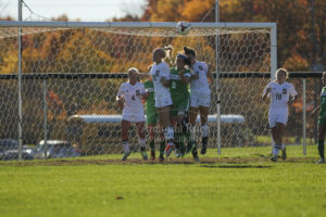 Cassidy Wood (18) & Pittaro (7) try to block shot on goal. Photo by Amanda "The Homeowner" Ruch